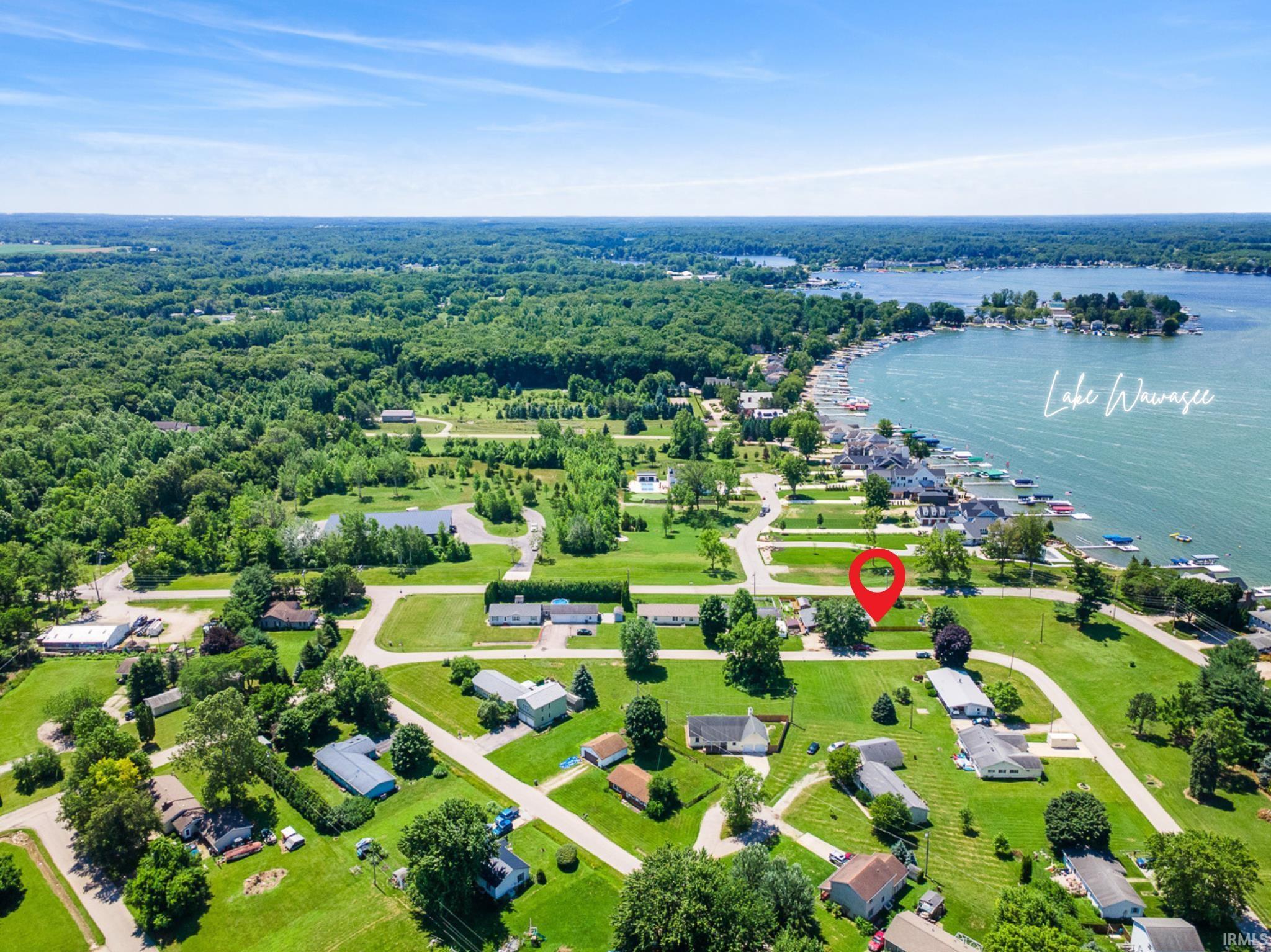 Image 3: Aerial view of property and surrounding area featuring a large body of water, Aerial View