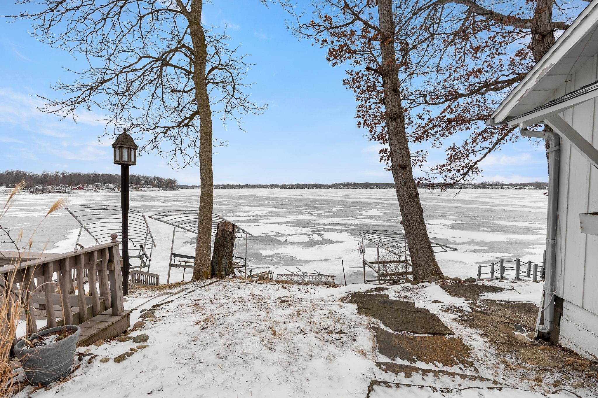 Image 2: View of yard layered in snow, Yard
