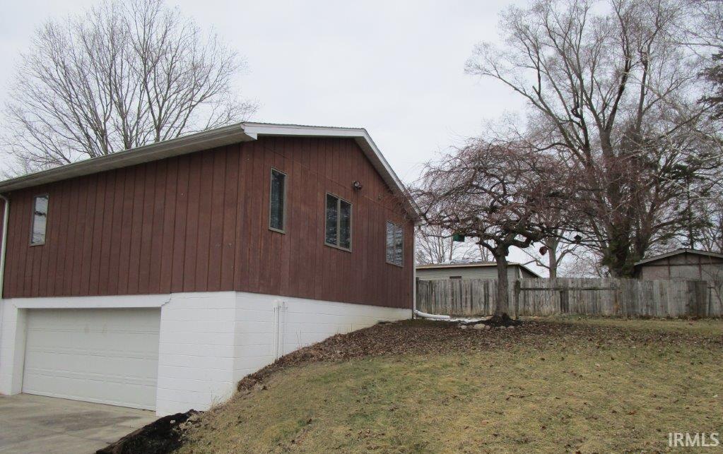 Image 2: View of side of property featuring driveway, Side Of Structure