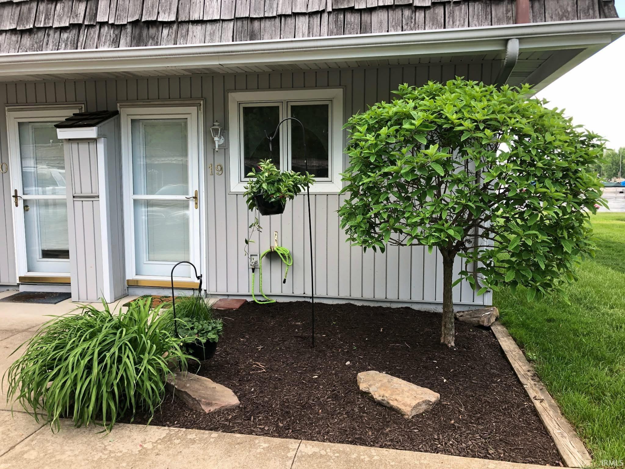 Image 0: Exterior featuring vertical panel siding and a natural wood shingle roof, Entry Image 0: Exterior featuring vertical panel siding and a natural wood shingle roof, Entry