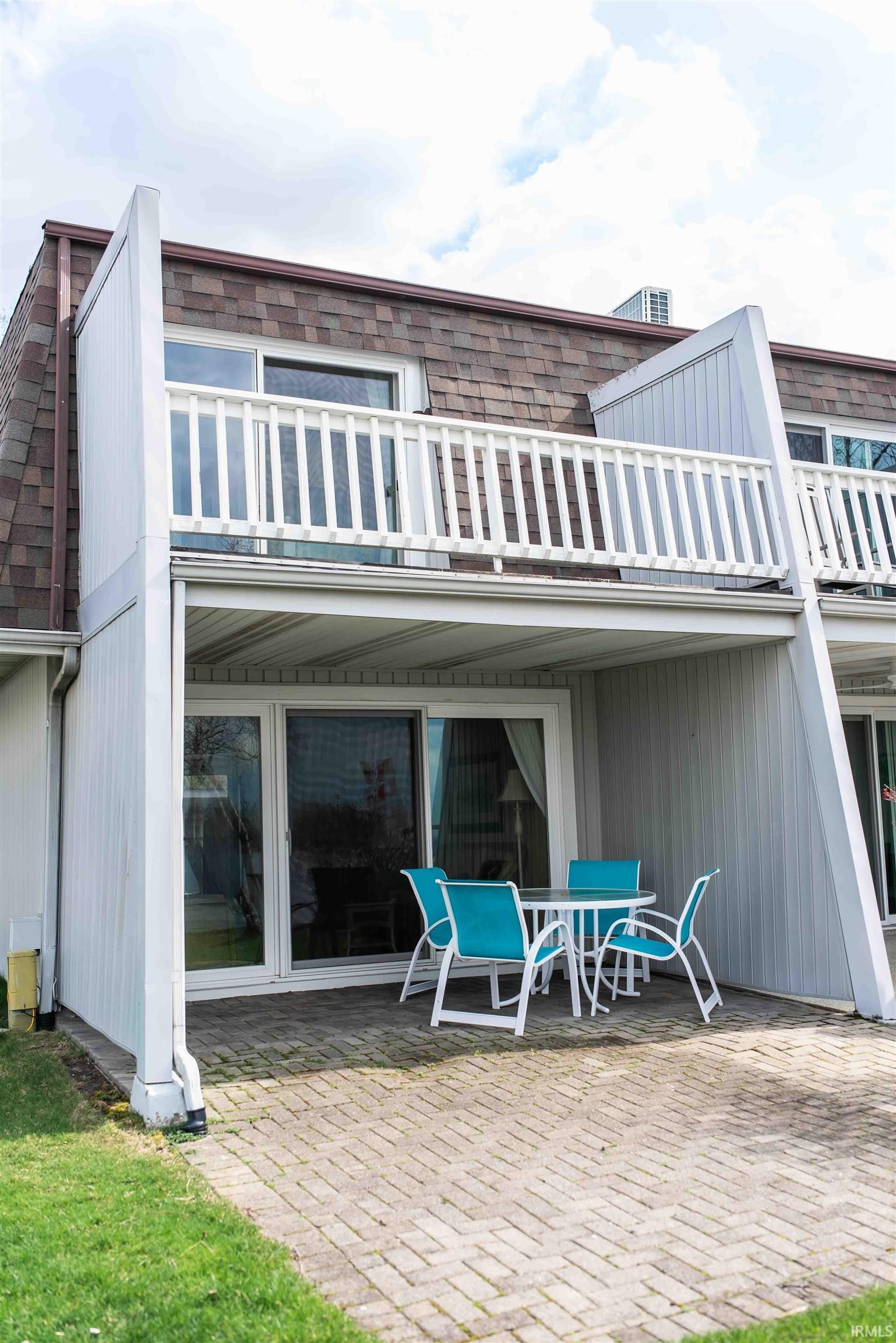 Image 2: Rear view of property with a patio and outdoor dining area, Back Of Structure Image 2: Rear view of property with a patio and outdoor dining area, Back Of Structure