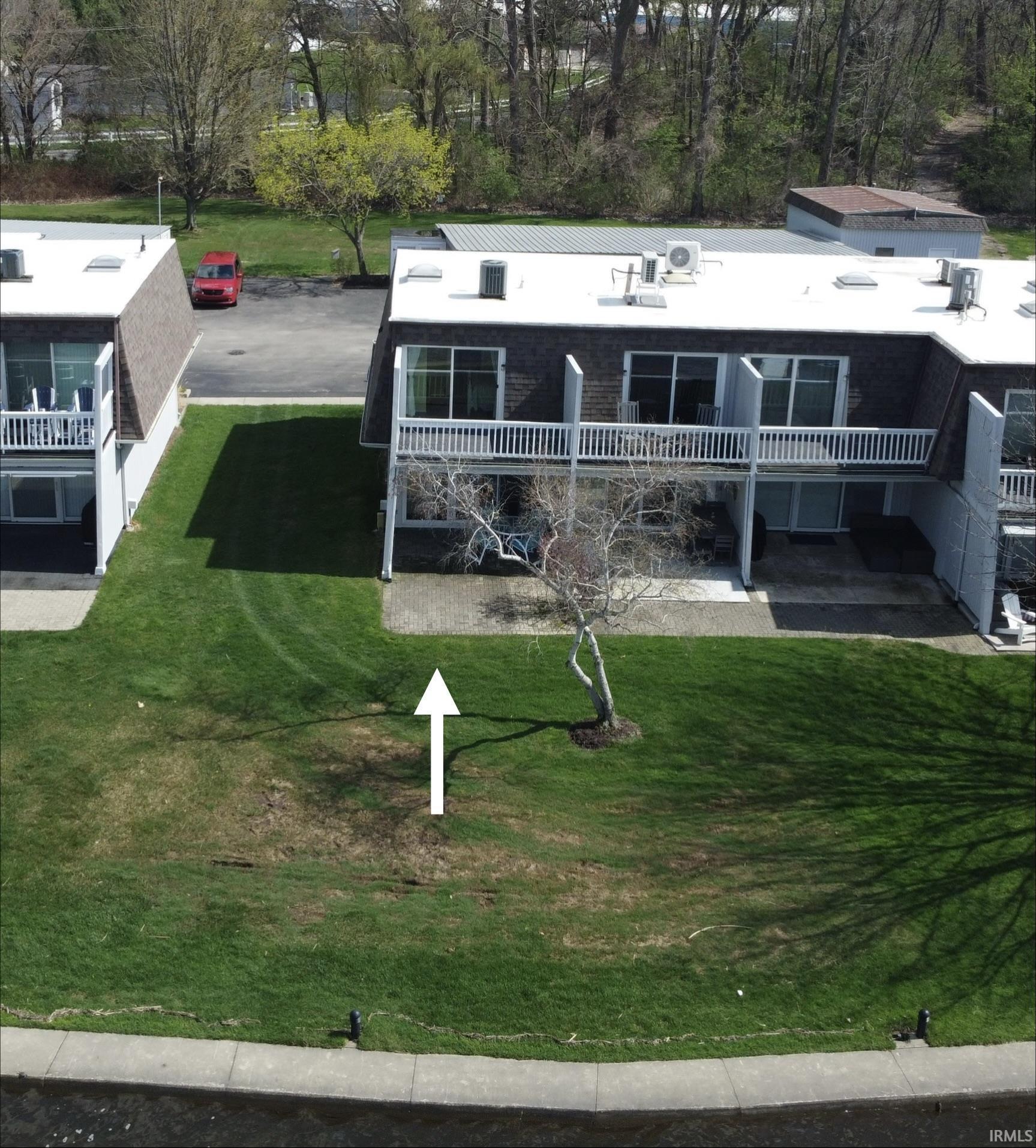 Image 3: Back of house with a patio and a lawn, Front Of Structure Image 3: Back of house with a patio and a lawn, Front Of Structure