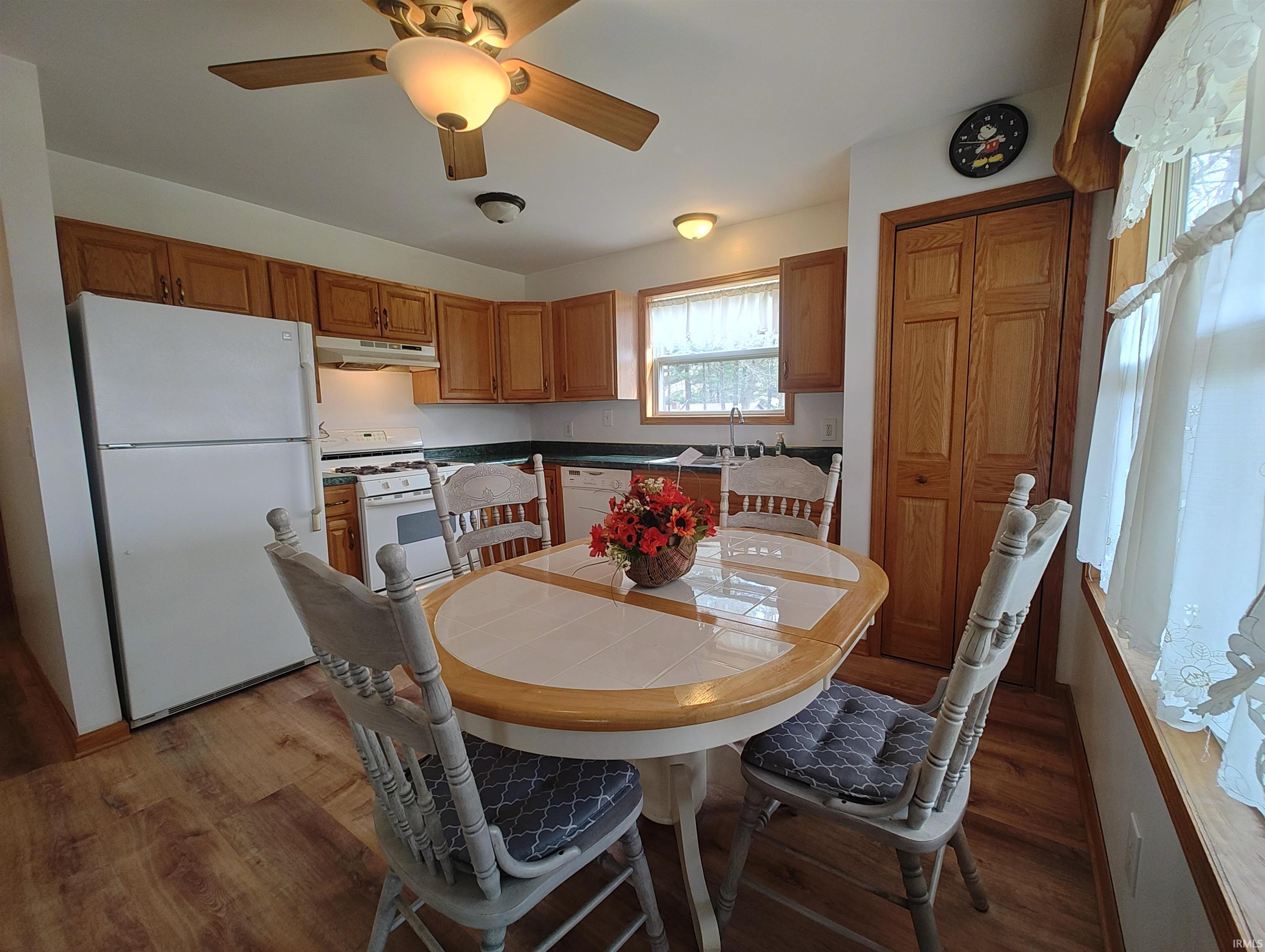 Image 2: Dining space featuring light wood finished floors and a ceiling fan, Dining Area