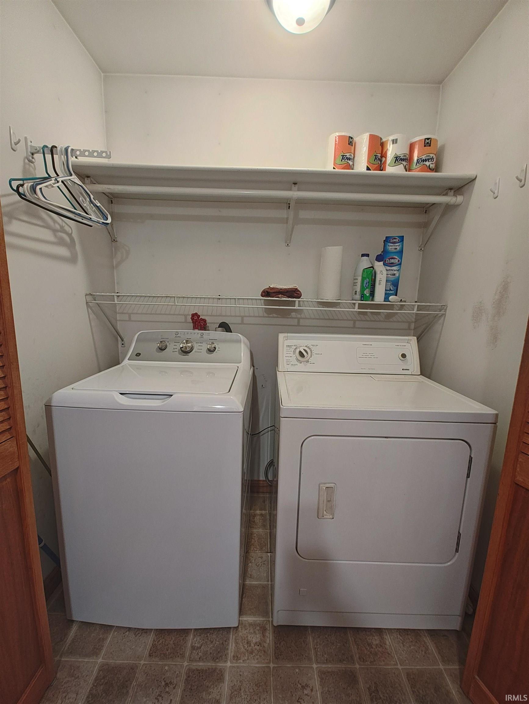 Image 3: Laundry area featuring washing machine and dryer, Laundry