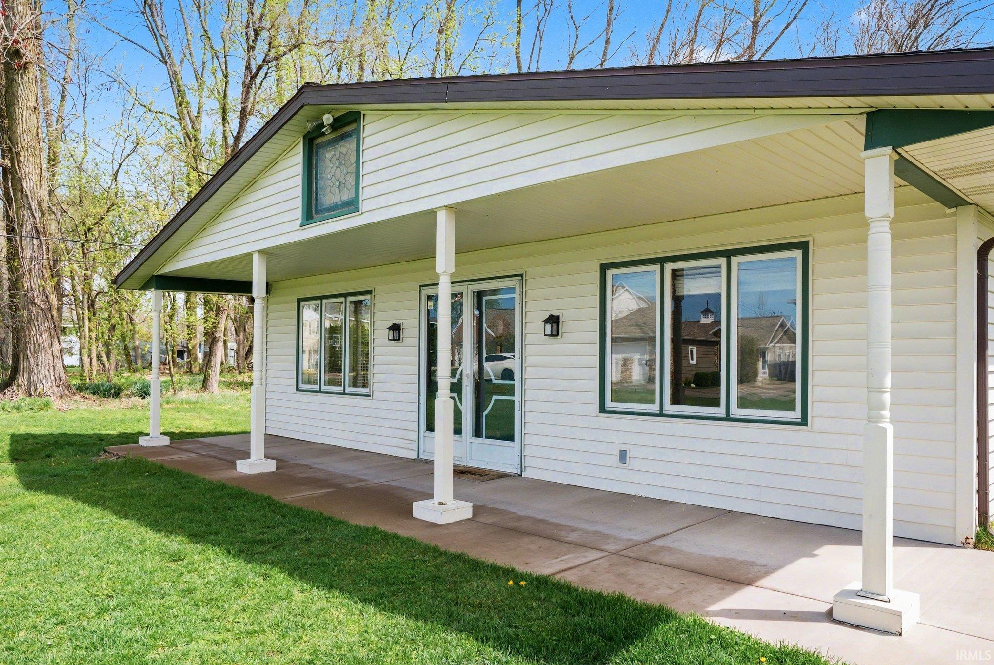 Image 2: View of front of home featuring a porch and a front yard, Front Of Structure