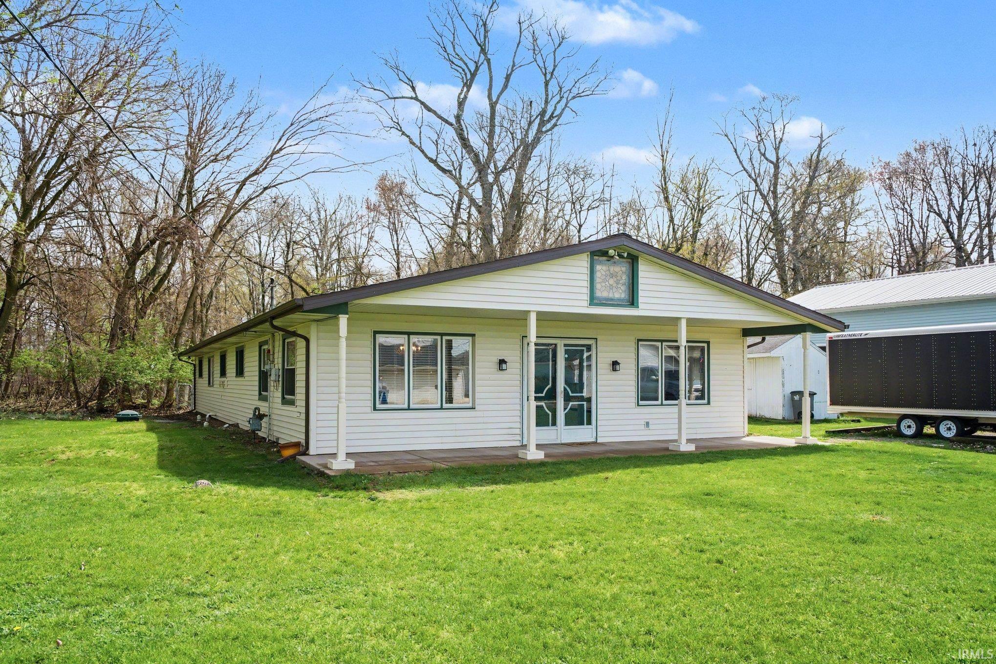 Image 3: View of front of property with a front yard and a porch, Front Of Structure