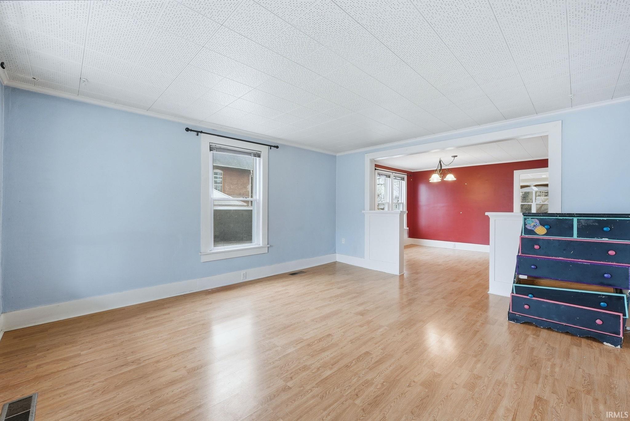 Image 3: Empty room with light wood finished floors, plenty of natural light, and ornamental molding, Other