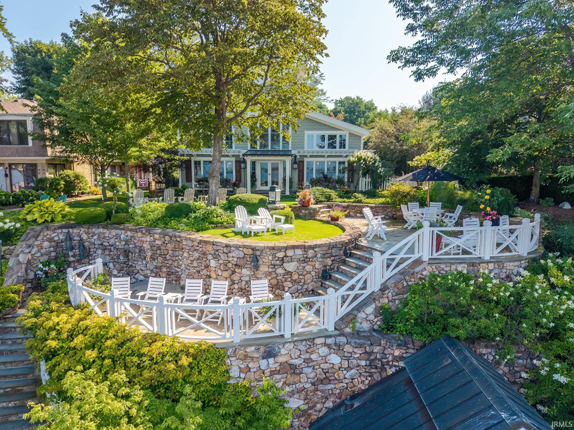 Image 0: Rear view of house featuring a patio and a chimney, Back Of Structure