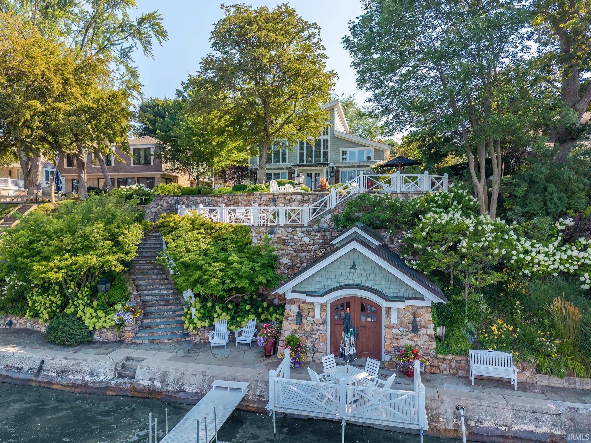 Image 1: View of property's community featuring a patio area and a boat dock, Community