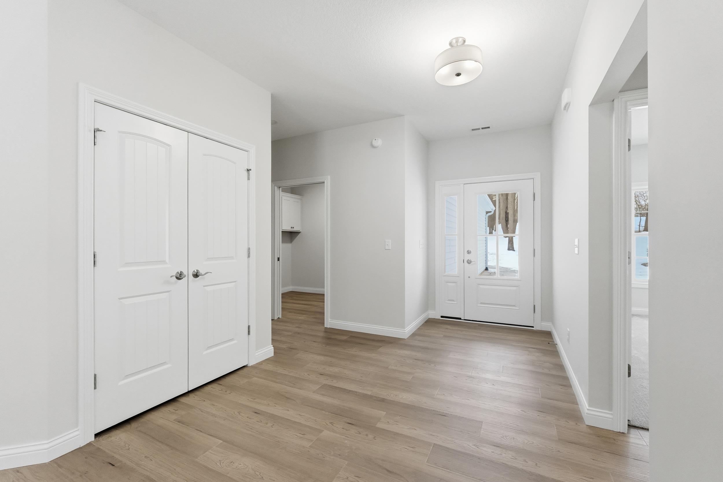 Image 4: Foyer entrance featuring light wood-style flooring and baseboards, Entrance Foyer