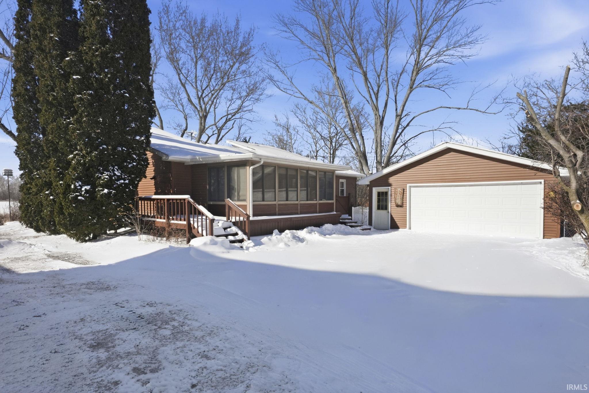 Image 3: Garage and Sunroom