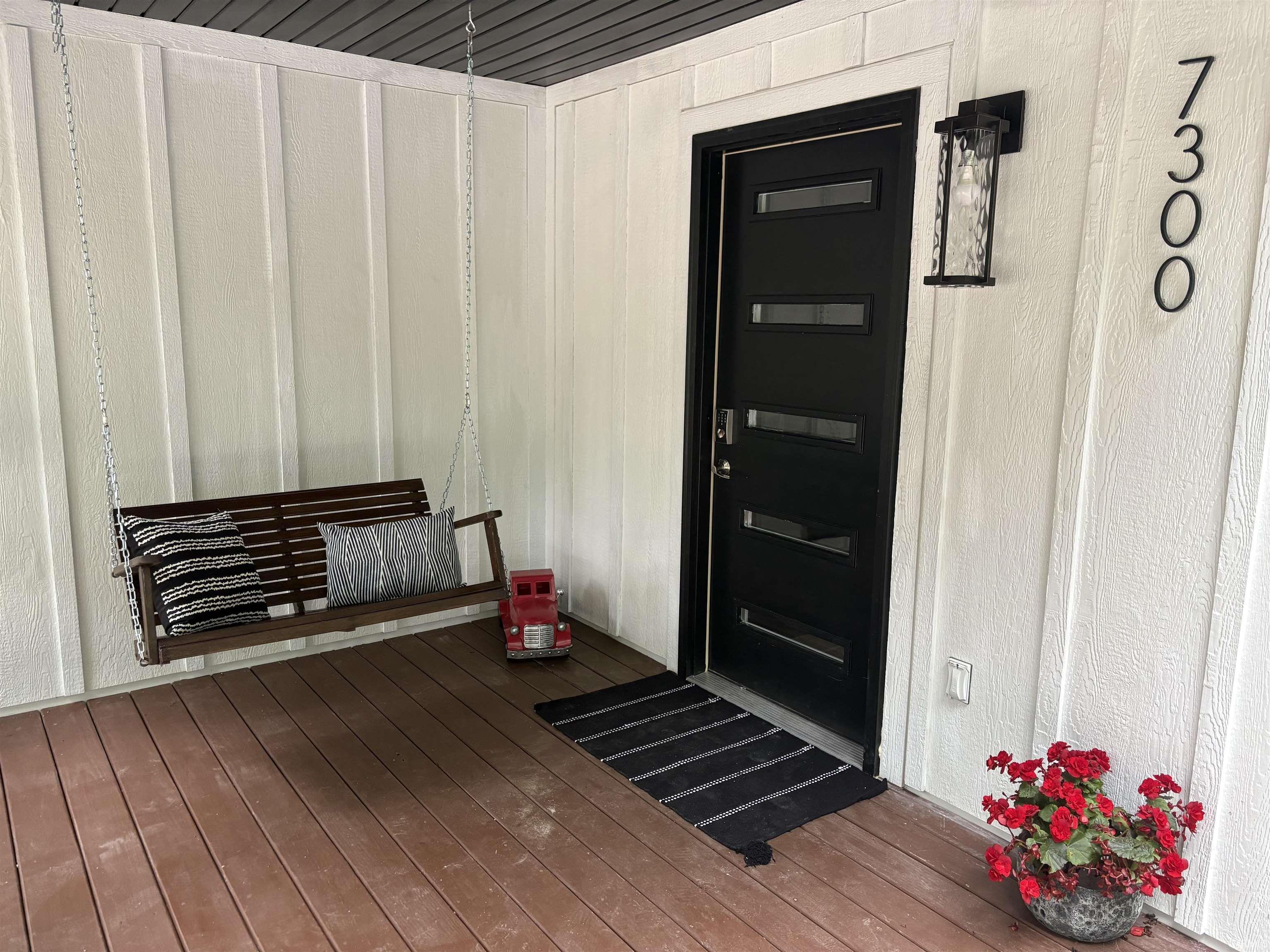 Image 1: Porch Swing on front porch