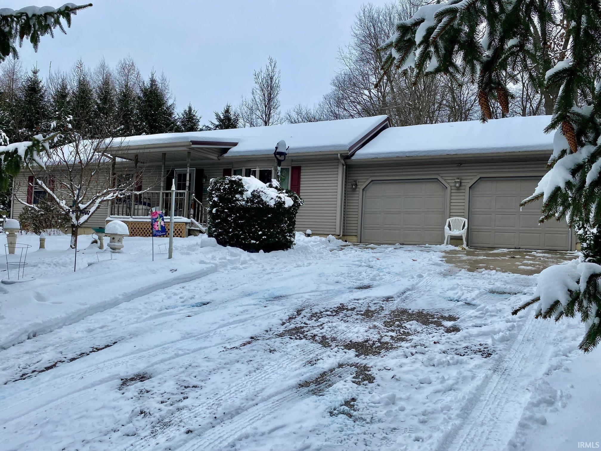 Image 1: Single story home with an attached garage, Front Of Structure