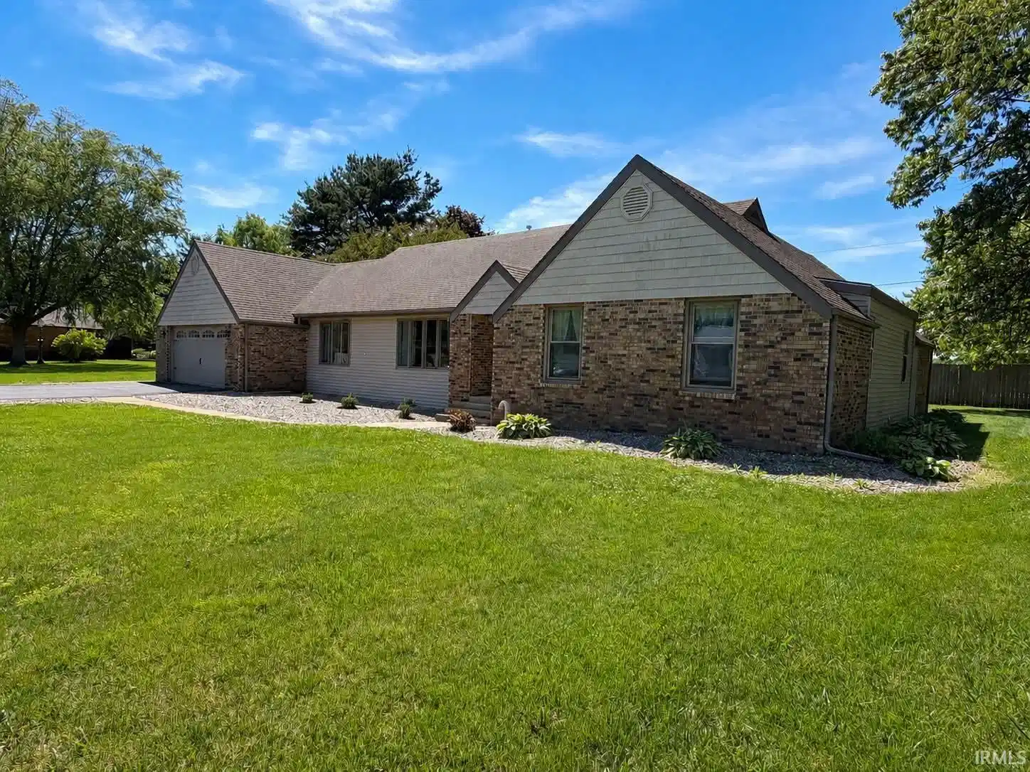 Image 0: Brick and siding exterior with a two-car garage, Front Of Structure Image 0: Brick and siding exterior with a two-car garage, Front Of Structure