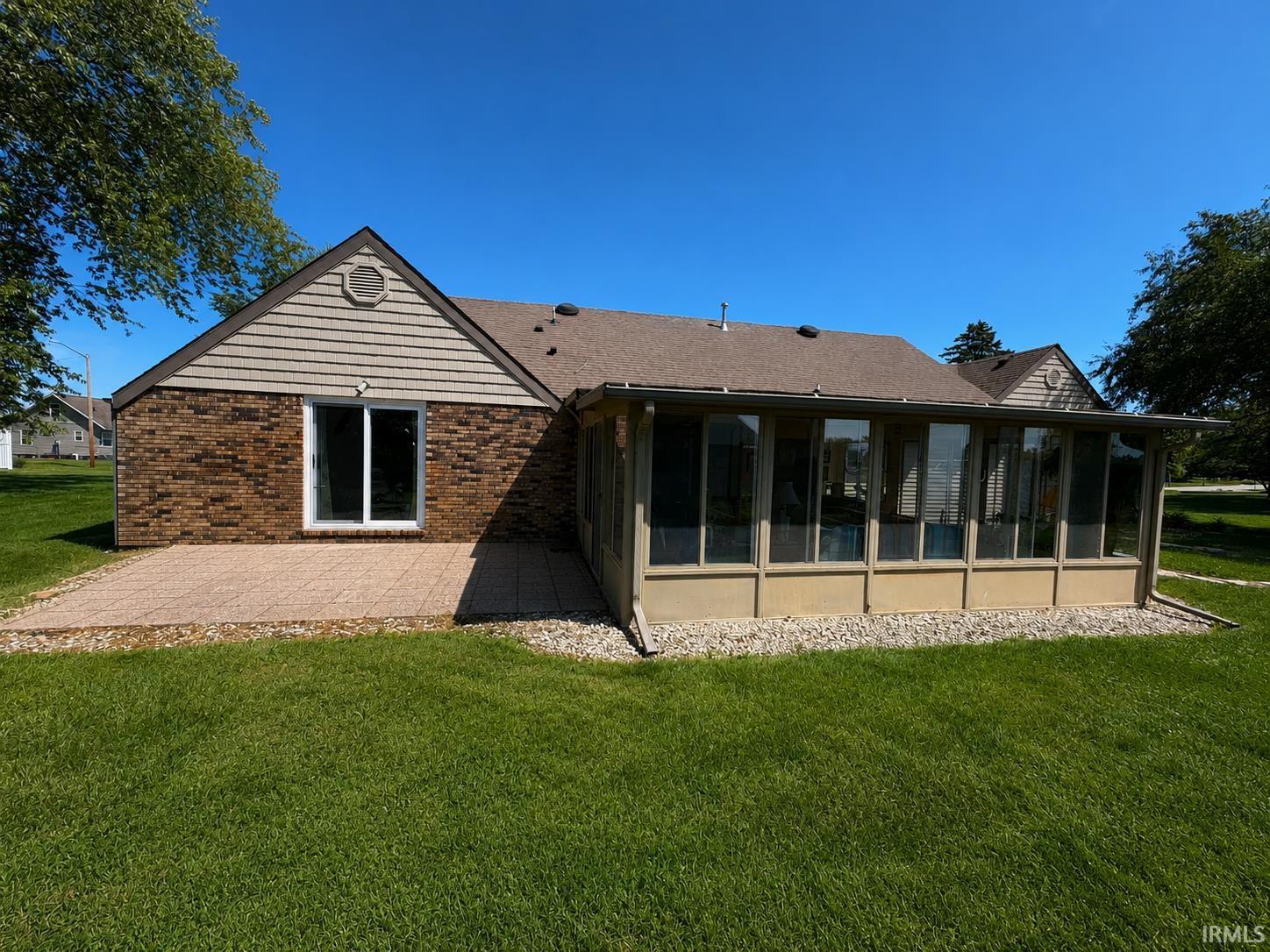 Image 3: Exterior brick and horizontal siding accents, Back Of Structure