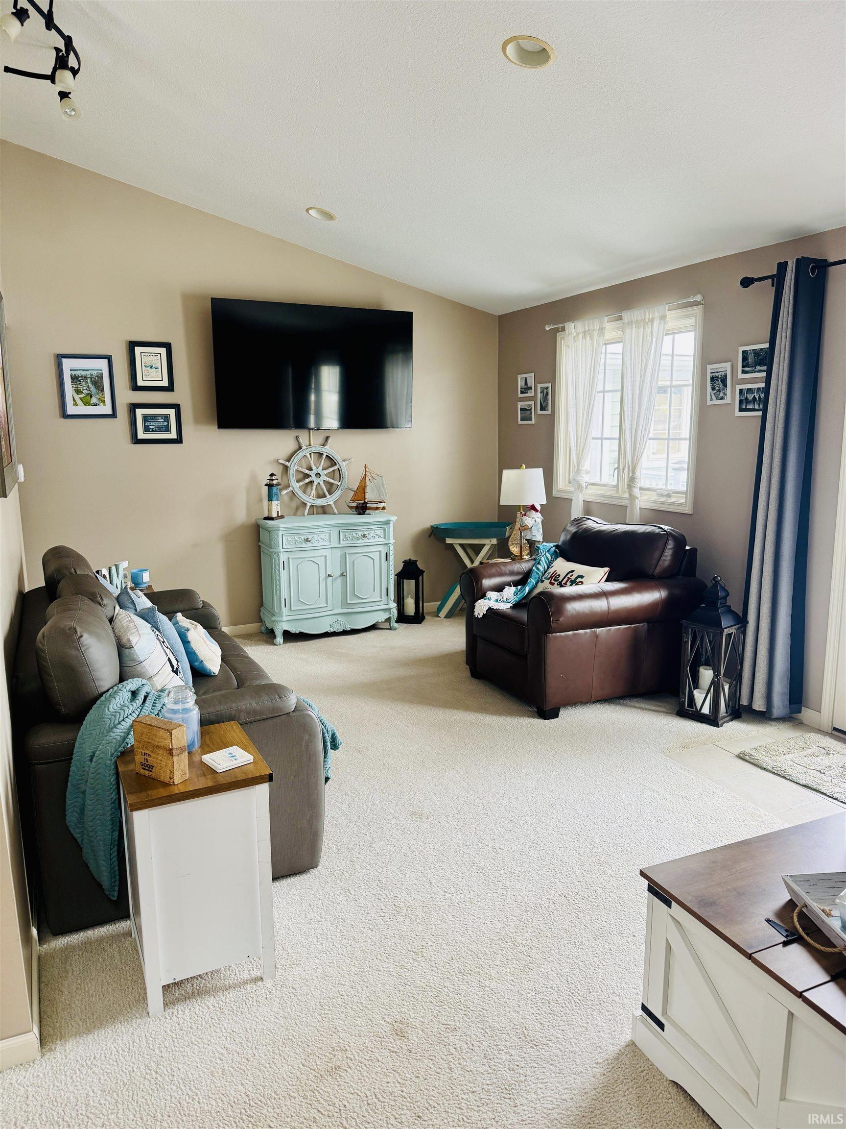 Image 1: Living room featuring light carpet and vaulted ceiling, Living Room