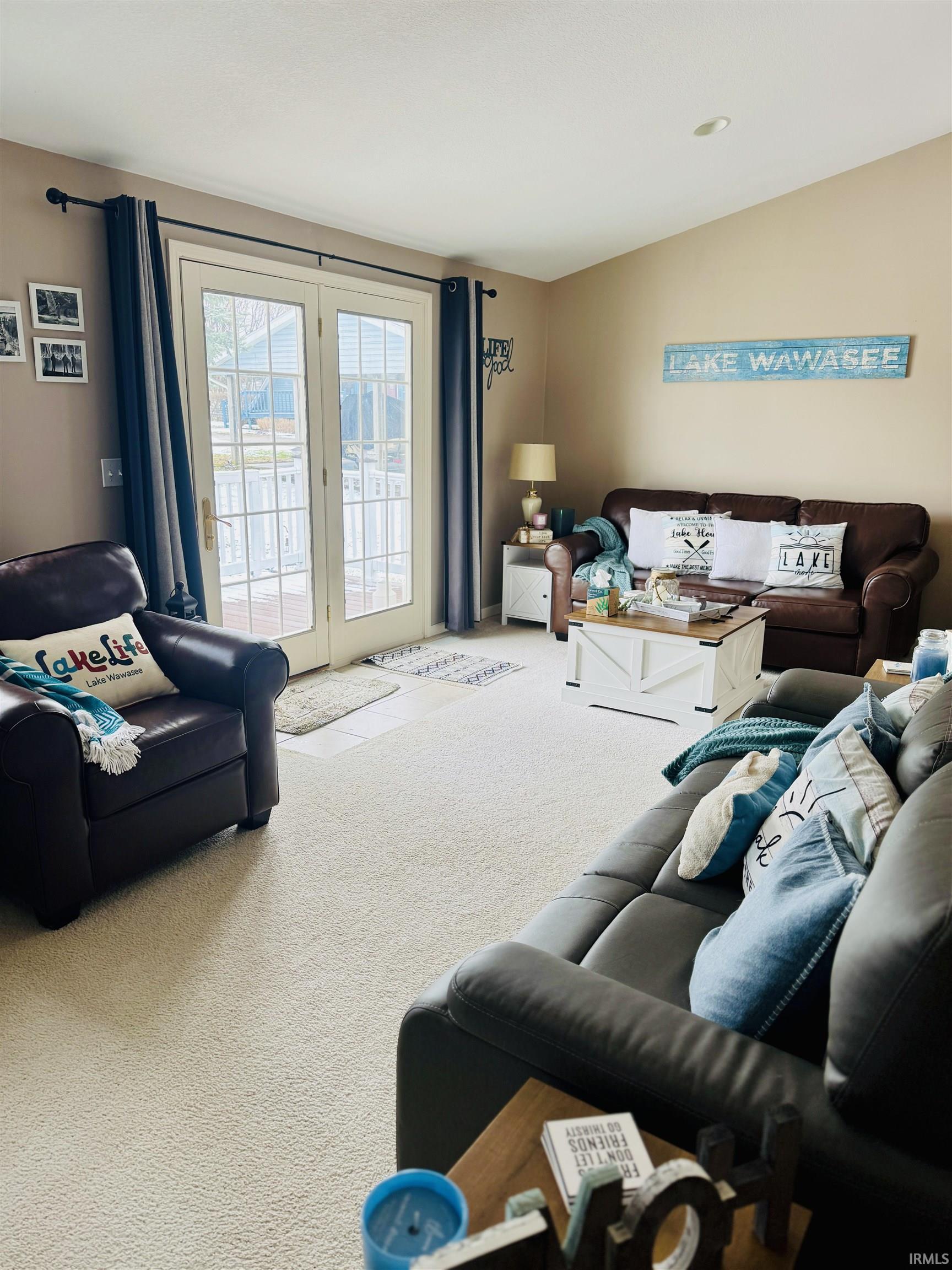 Image 3: Living room with carpet flooring and french doors, Living Room