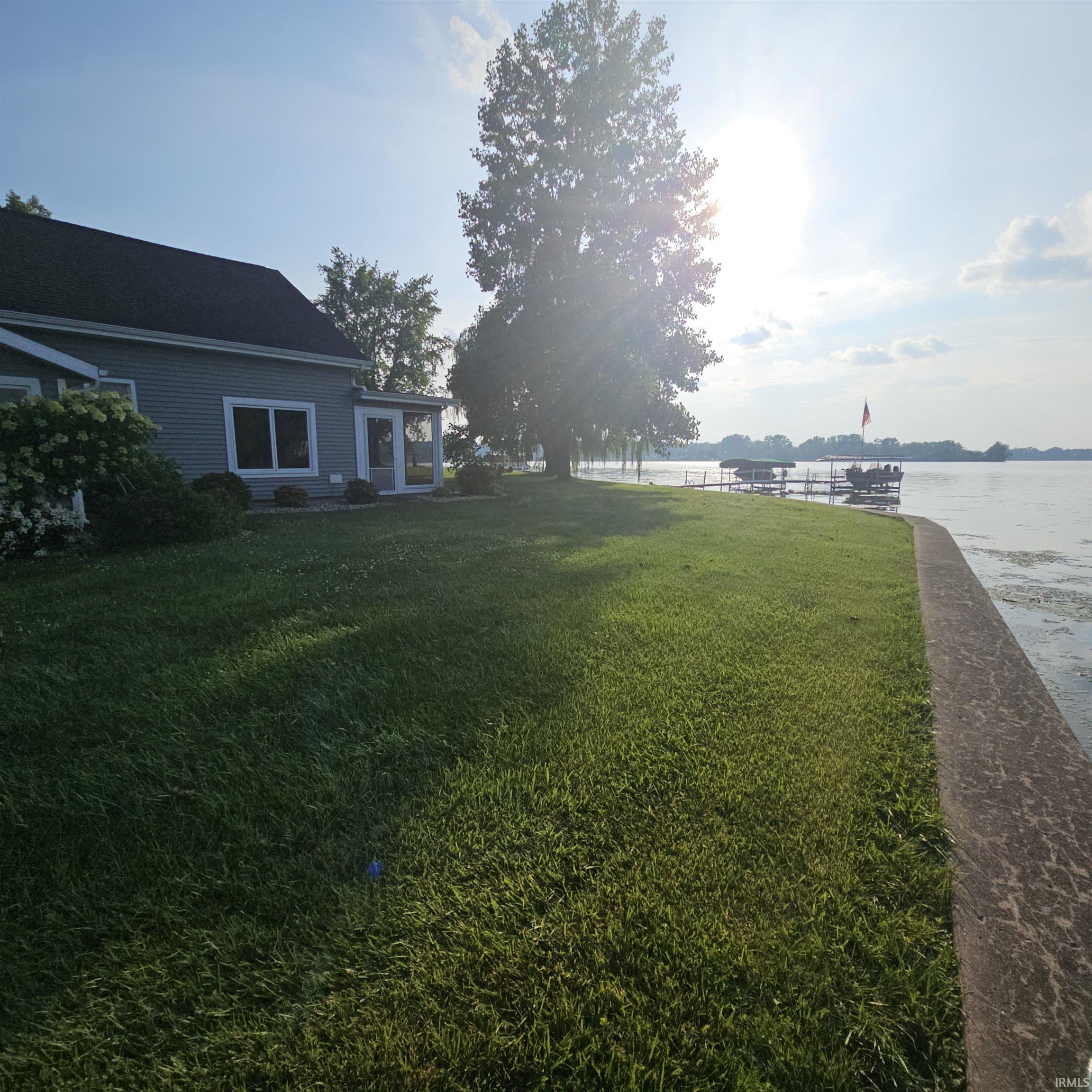 Image 3: View of grassy yard featuring a water view, Yard
