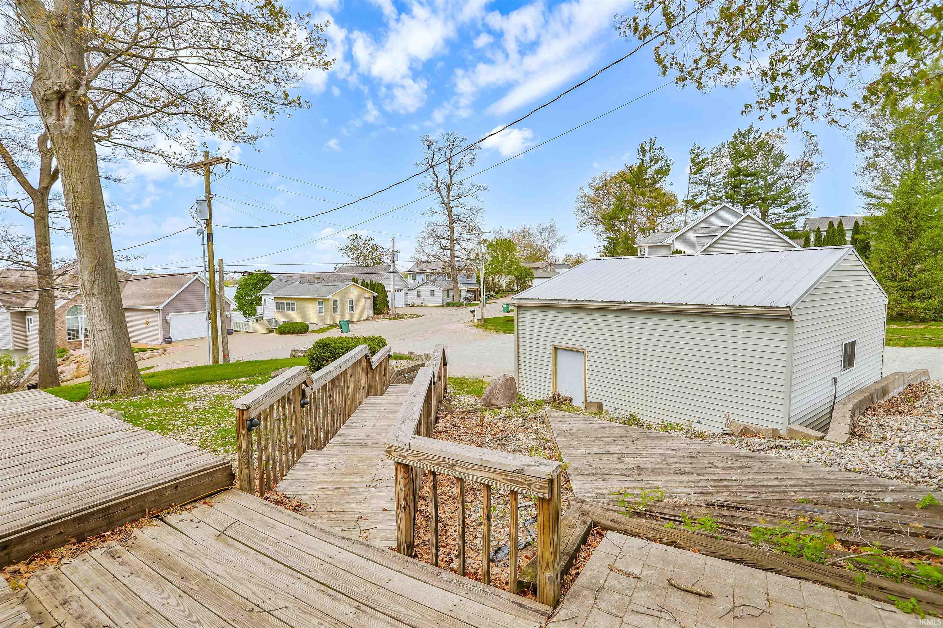 Image 2: Expansive wood deck with integrated stairs and railings, Deck