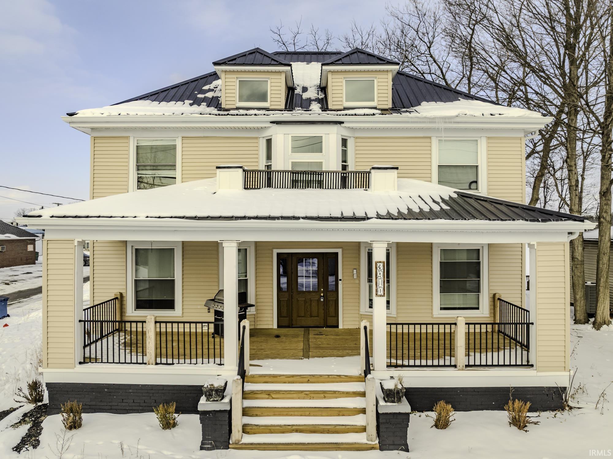 Image 0: View of front of home featuring a porch and a metal roof, Front Of Structure Image 0: View of front of home featuring a porch and a metal roof, Front Of Structure