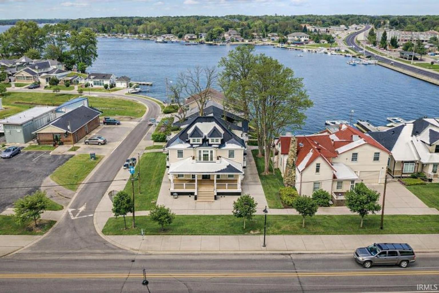 Image 2: Aerial perspective of suburban area featuring a large body of water, Aerial View Image 2: Aerial perspective of suburban area featuring a large body of water, Aerial View
