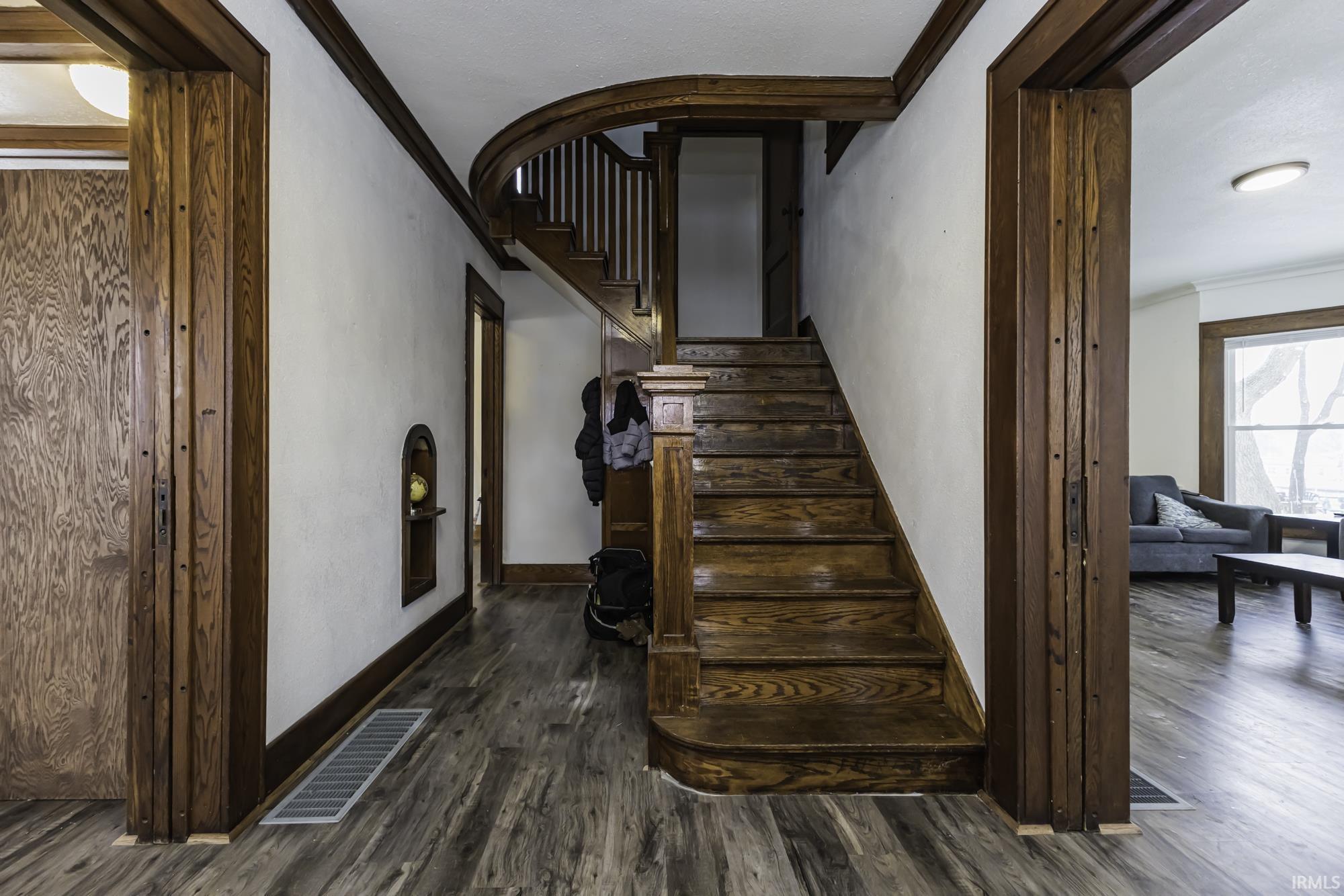 Image 3: Stairs featuring ornamental molding and wood finished floors, Stairs Image 3: Stairs featuring ornamental molding and wood finished floors, Stairs