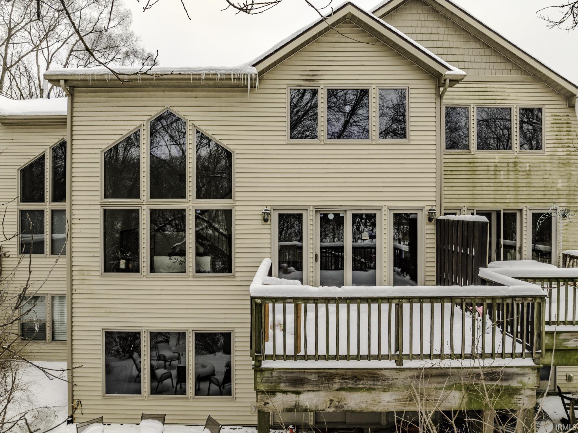 Image 2: Back of property featuring a wooden deck, Back Of Structure