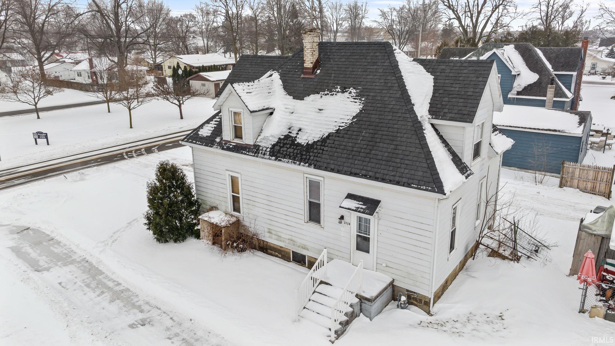 Image 3: Snowy aerial view with a residential view, Aerial View