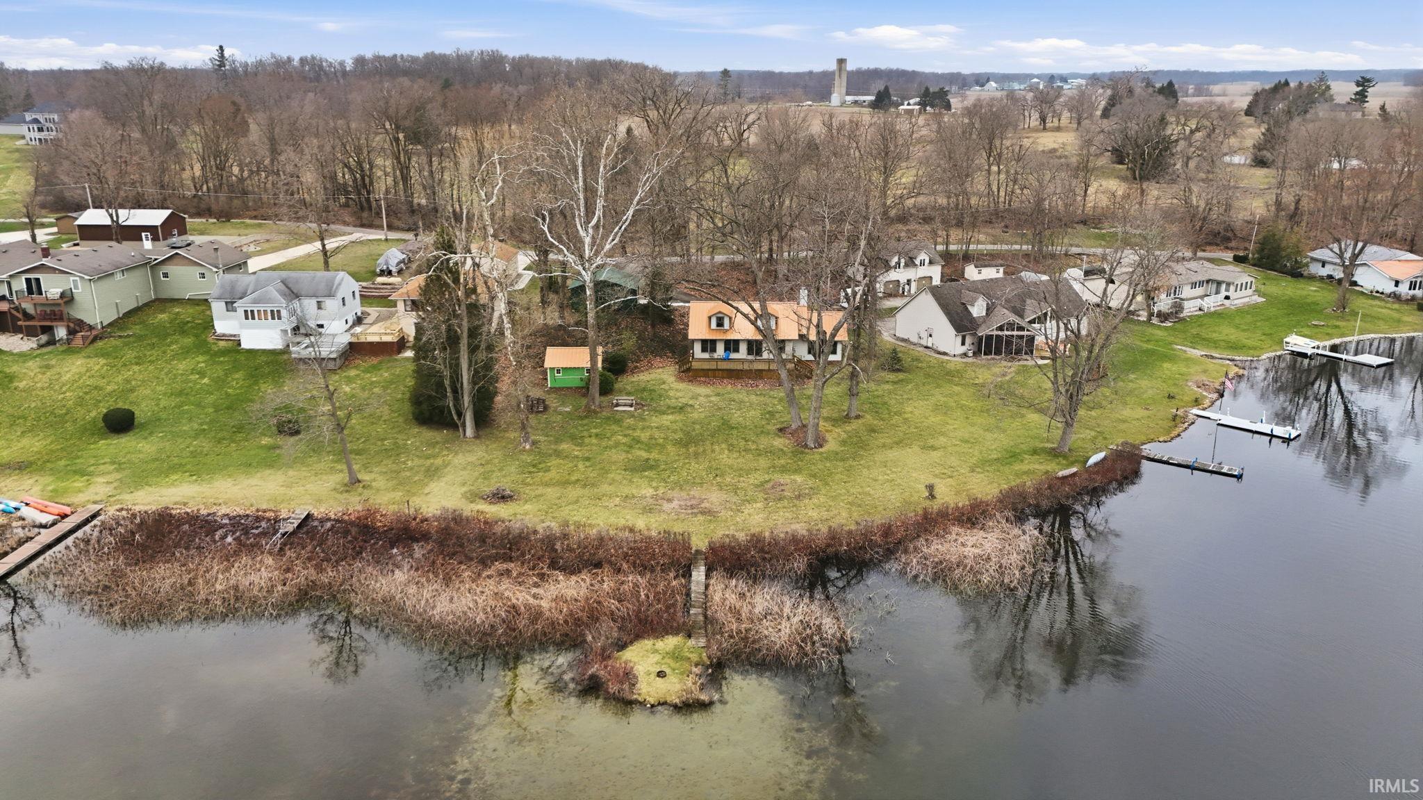 Image 0: Aerial view of residential area with a large body of water, Aerial View