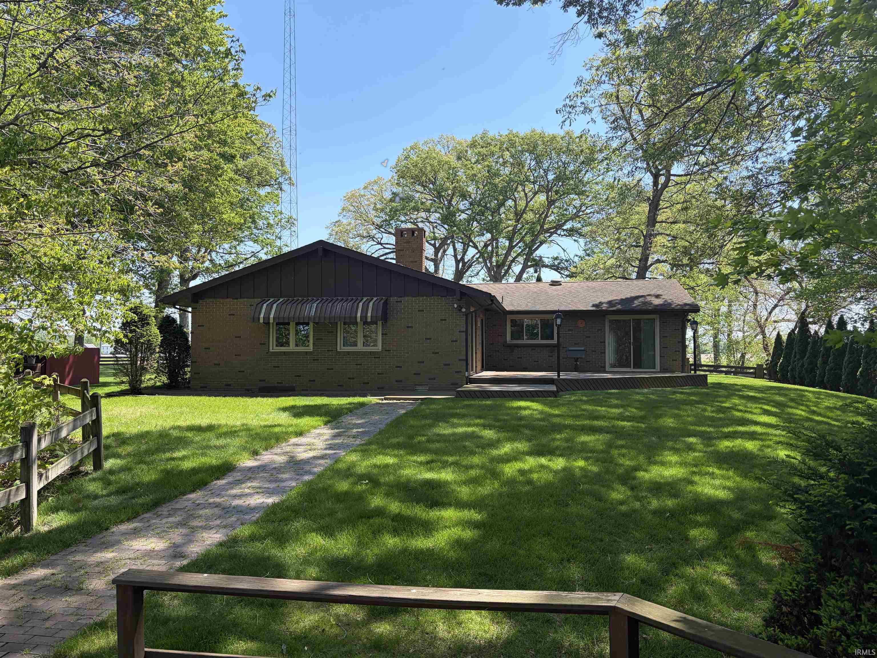 Image 2: Brick exterior featuring a gabled roof and a side deck, Back Of Structure Image 2: Brick exterior featuring a gabled roof and a side deck, Back Of Structure