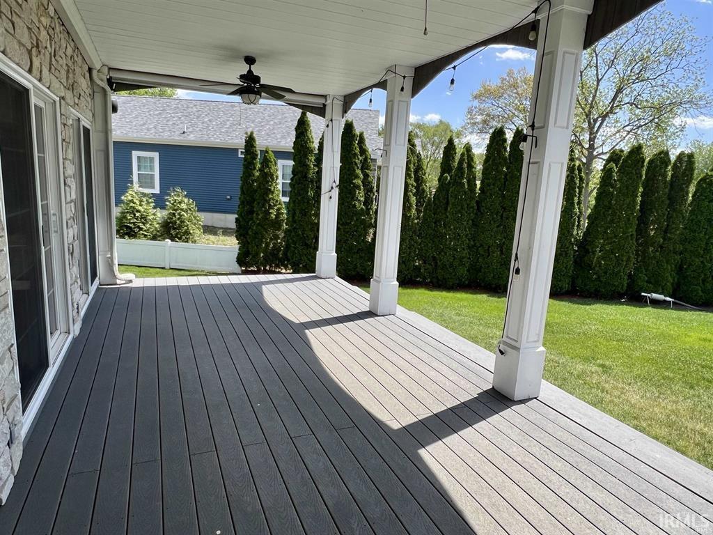 Image 2: Porch with ceiling fan and a yard, Deck