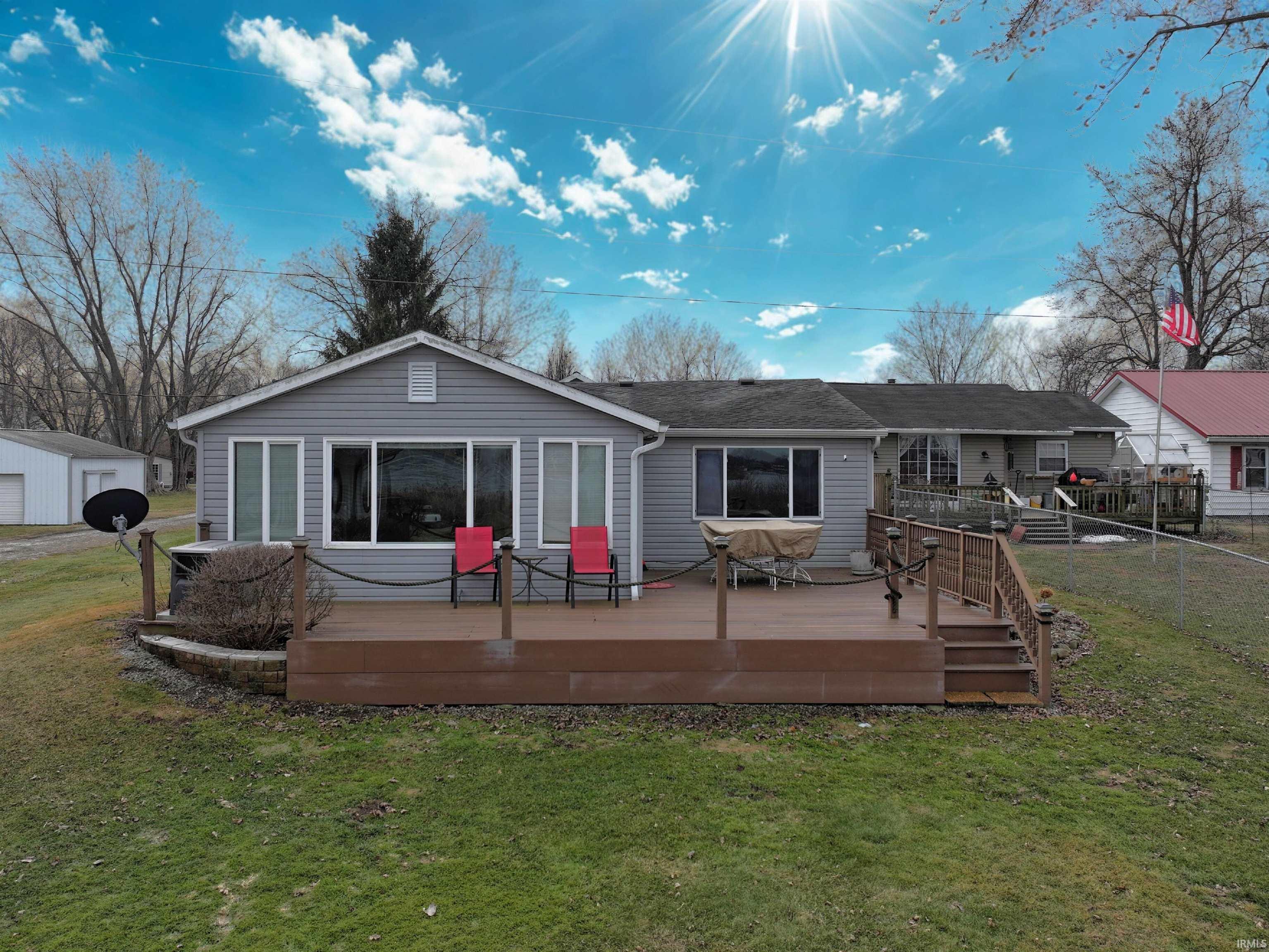 Image 0: Back of house with a yard and a deck, Back Of Structure
