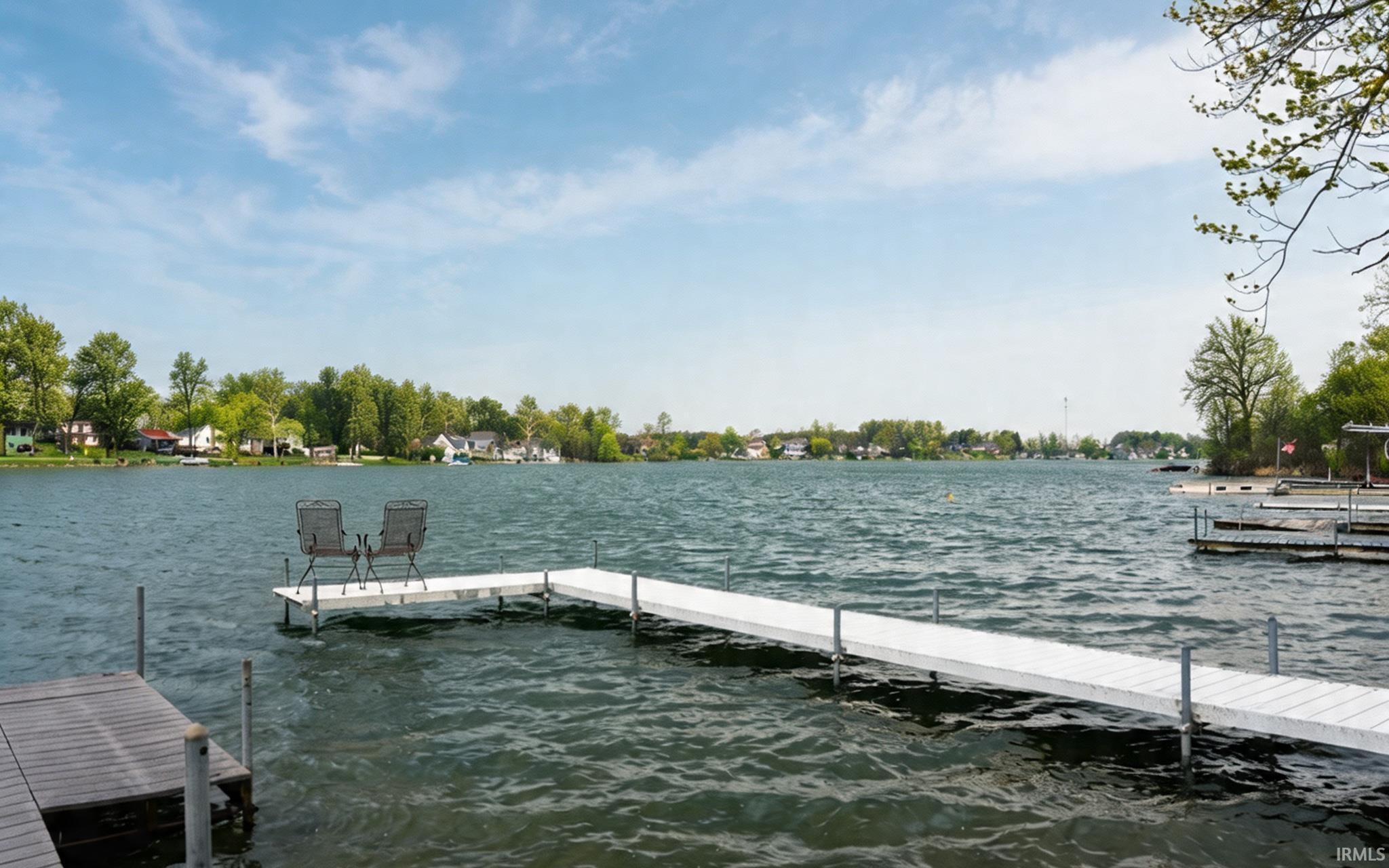 Image 1: Dock area featuring a water view, Dock