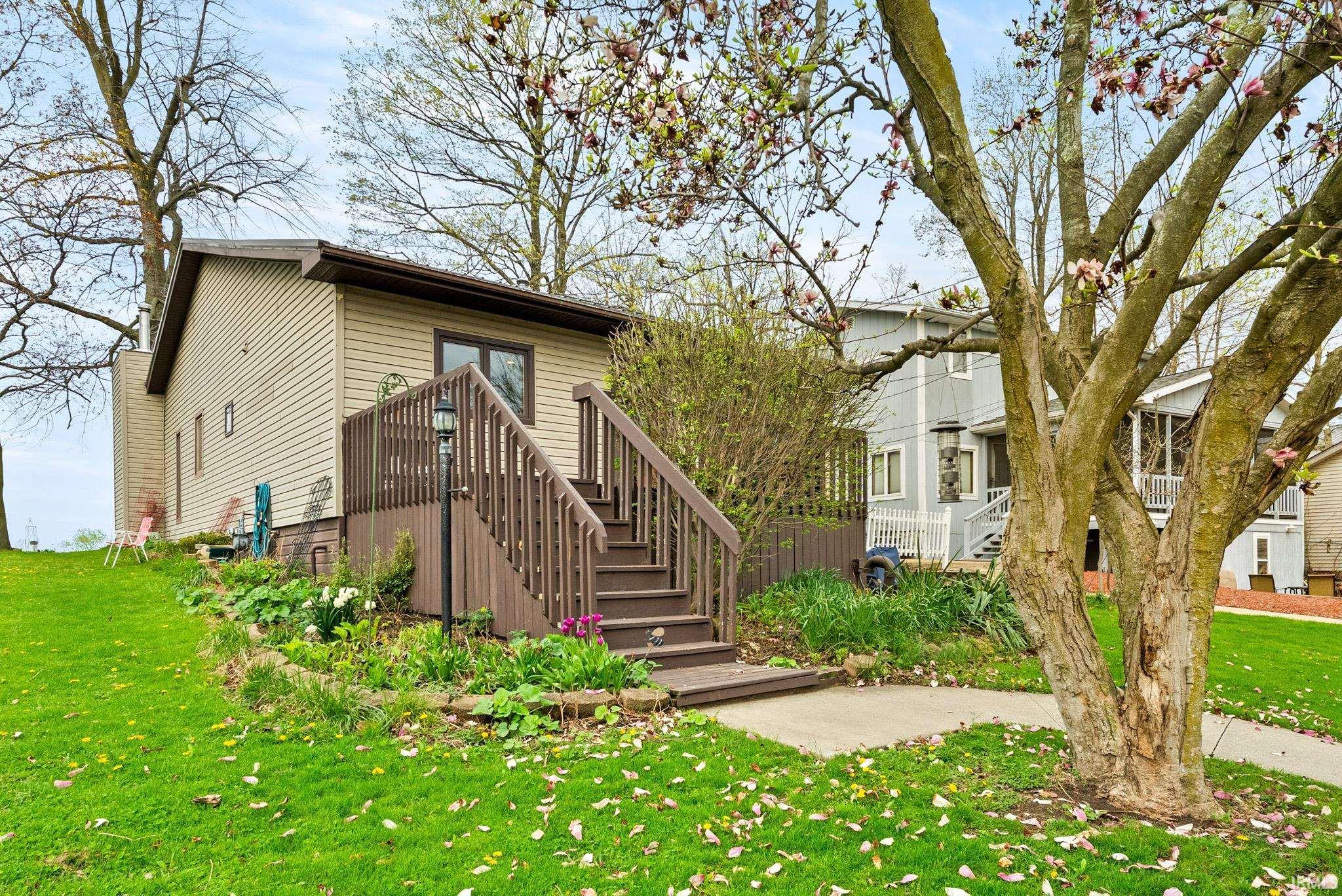 Image 2: View of front facade featuring a front yard and stairs, Front Of Structure