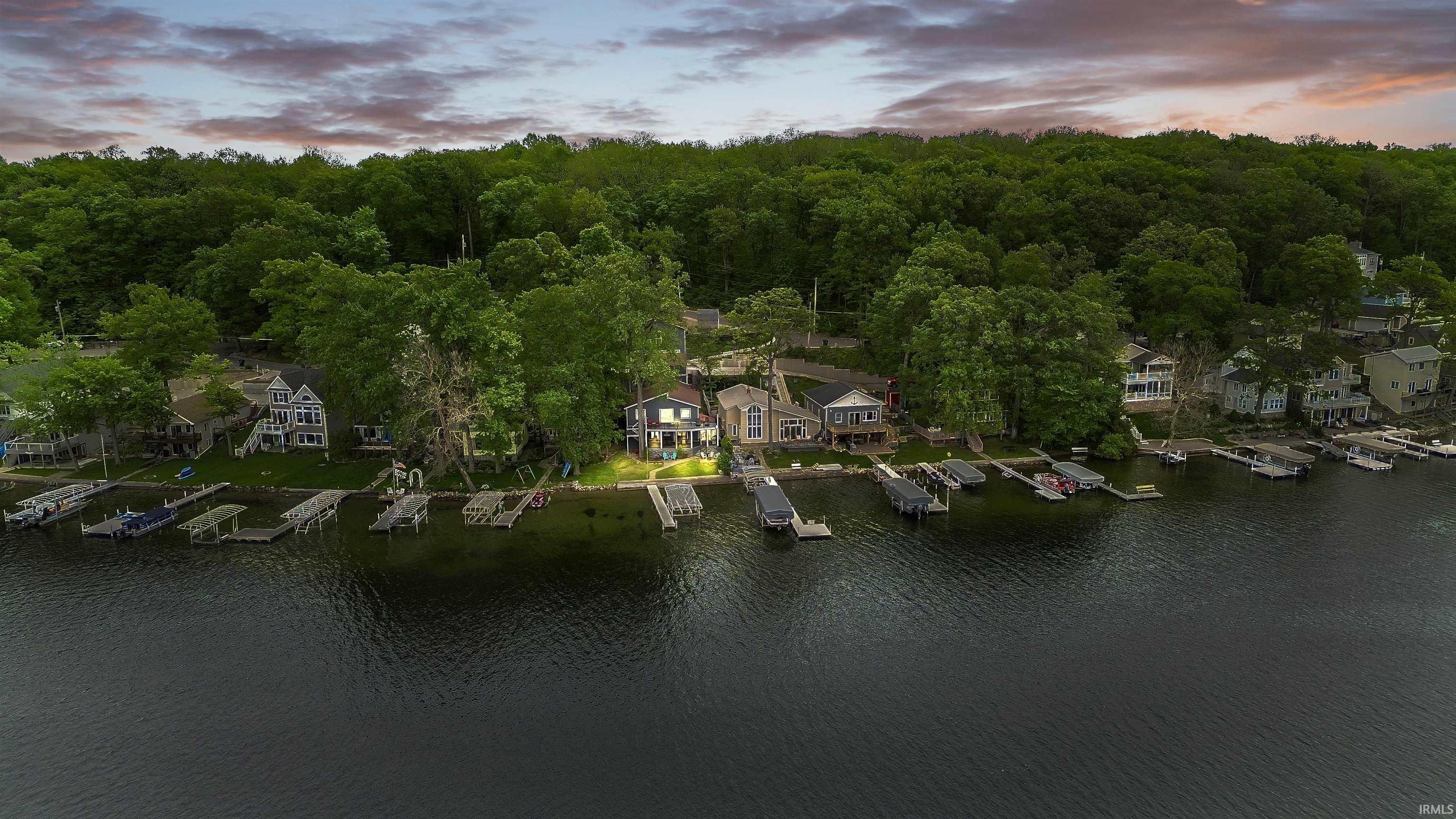 Image 0: Waterfront property featuring a private dock and direct lake access, Aerial View Image 0: Waterfront property featuring a private dock and direct lake access, Aerial View
