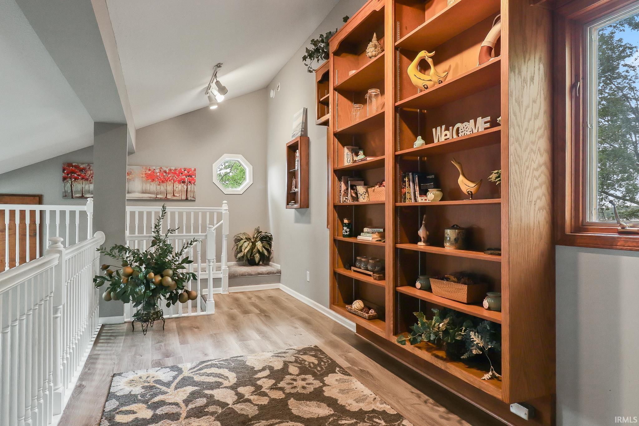 Image 3: Built-in wood shelving units with ample storage, Hallway Image 3: Built-in wood shelving units with ample storage, Hallway