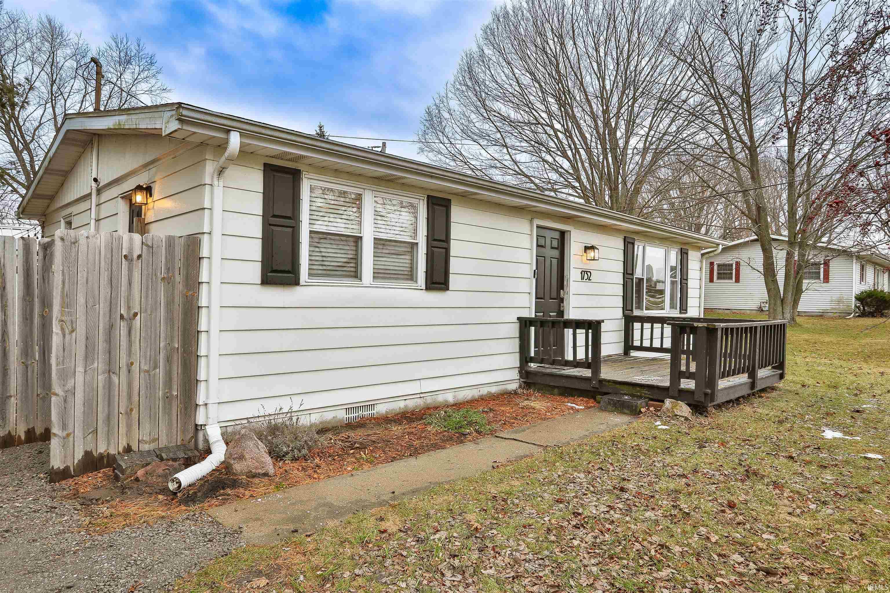 Image 0: View of front of property featuring a wooden deck and crawl space, Front Of Structure Image 0: View of front of property featuring a wooden deck and crawl space, Front Of Structure