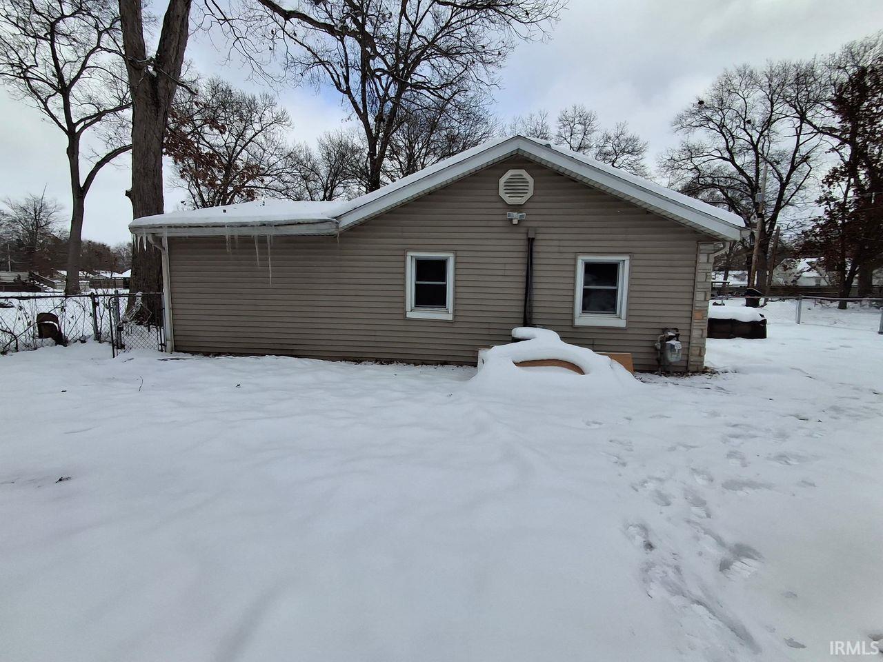 Image 2: View of snow covered rear of property, Back Of Structure