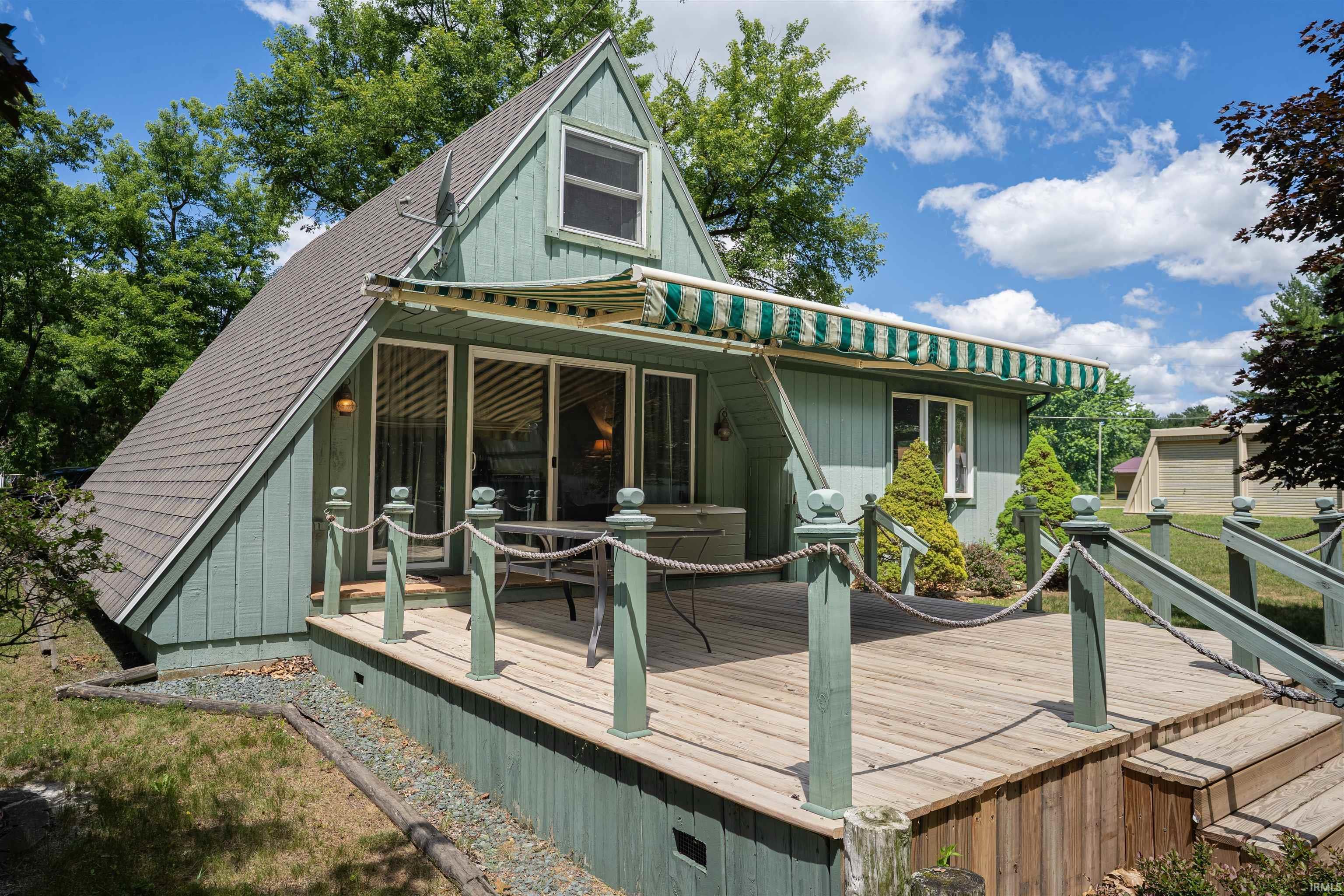 Image 3: A-frame residence with an expansive 16 x 16 wood deck, Back of Home Image 3: A-frame residence with an expansive 16 x 16 wood deck, Back of Home