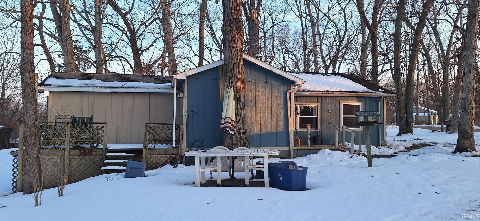 Image 1: View of front facade featuring a deck, Front Of Structure
