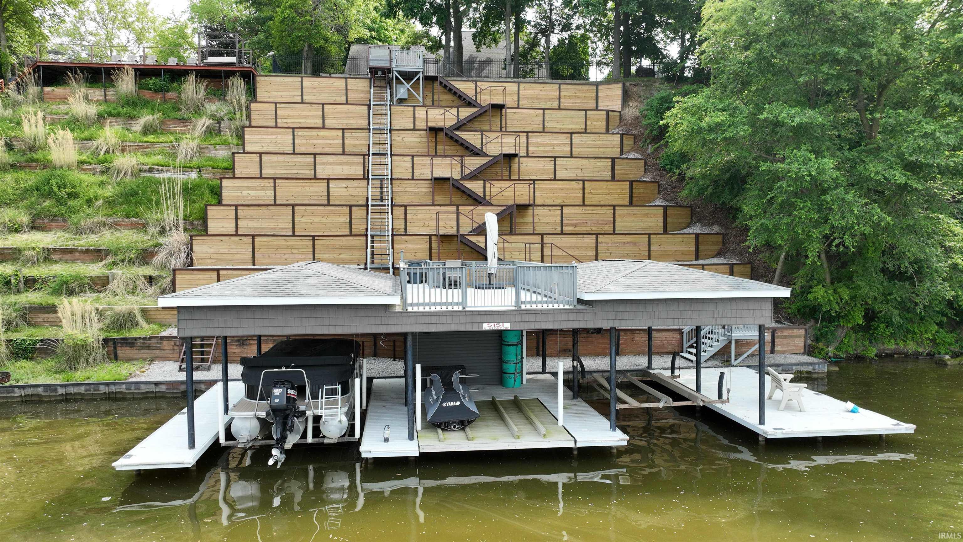Image 3: Dock with boat lift and a water view, Dock