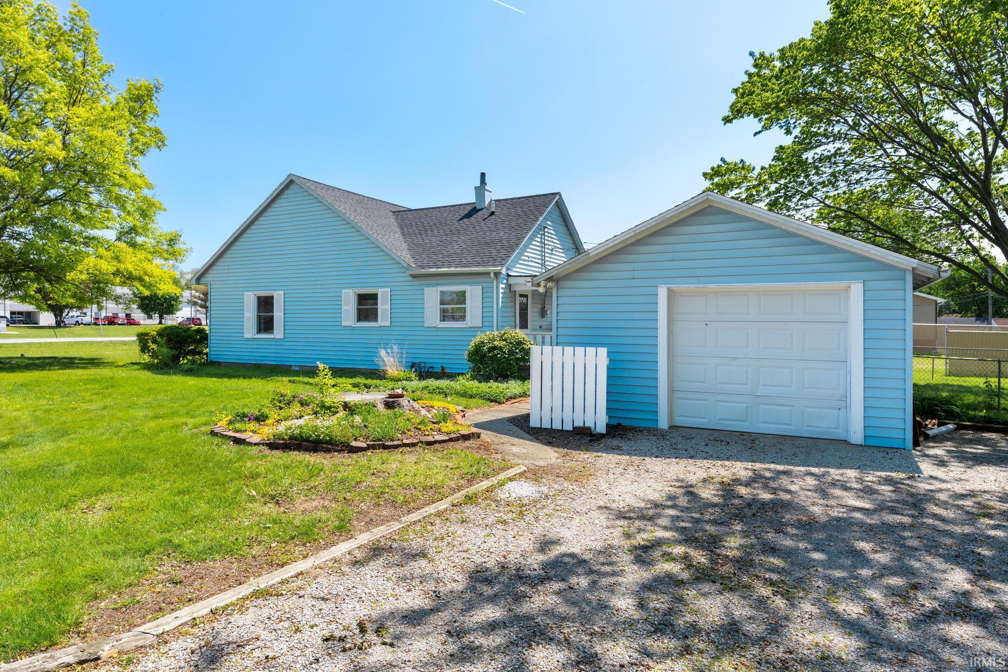 Image 0: Light blue siding with white trim, a dark shingle roof, and white window shutters, Front Of Structure Image 0: Light blue siding with white trim, a dark shingle roof, and white window shutters, Front Of Structure