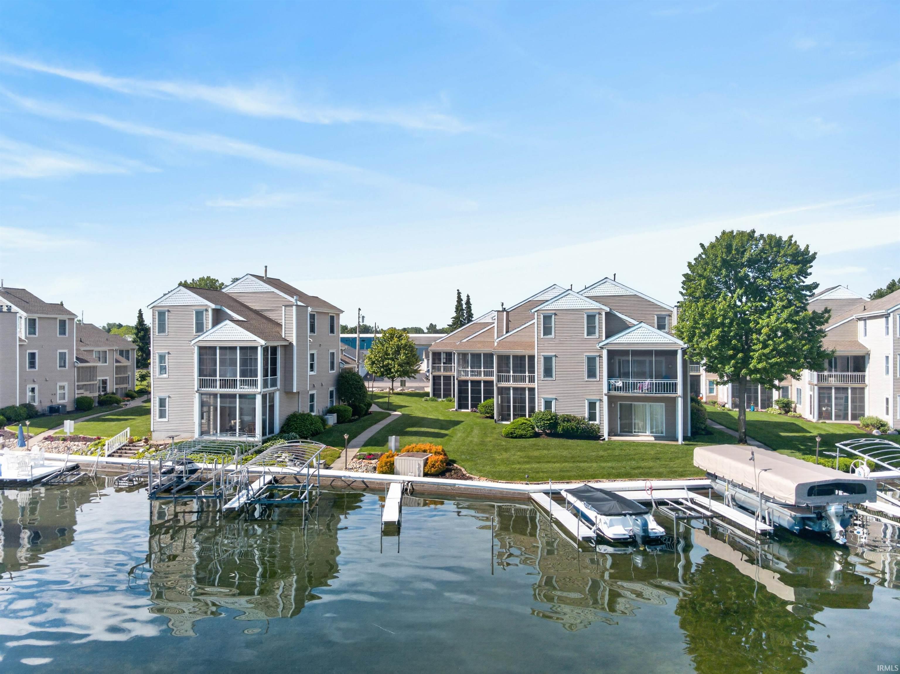 Image 0: Waterfront property featuring multiple boat slips and docks, Dock