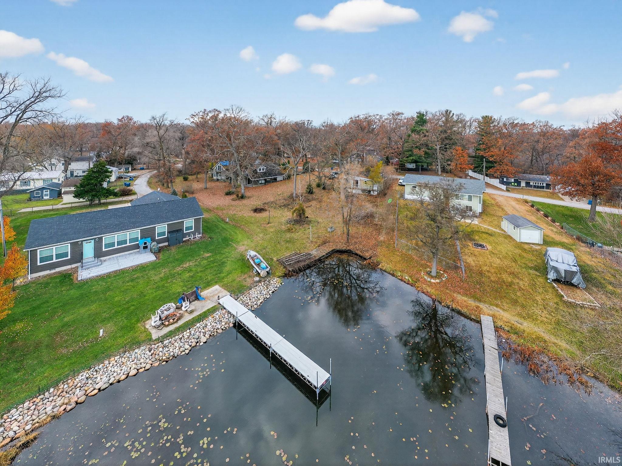 Image 2: Drone / aerial view of a large body of water and a tree filled landscape, Aerial View
