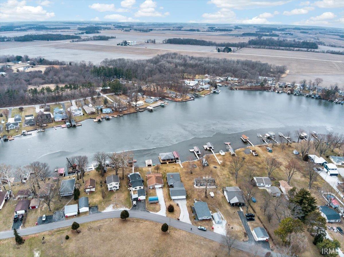 Image 1: View of property location featuring a nearby body of water and nearby suburban area, Aerial View