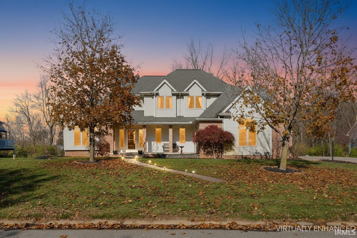 Image 0: Traditional-style home featuring covered porch, a front yard, and a shingled roof, Front Of Structure Image 0: Traditional-style home featuring covered porch, a front yard, and a shingled roof, Front Of Structure