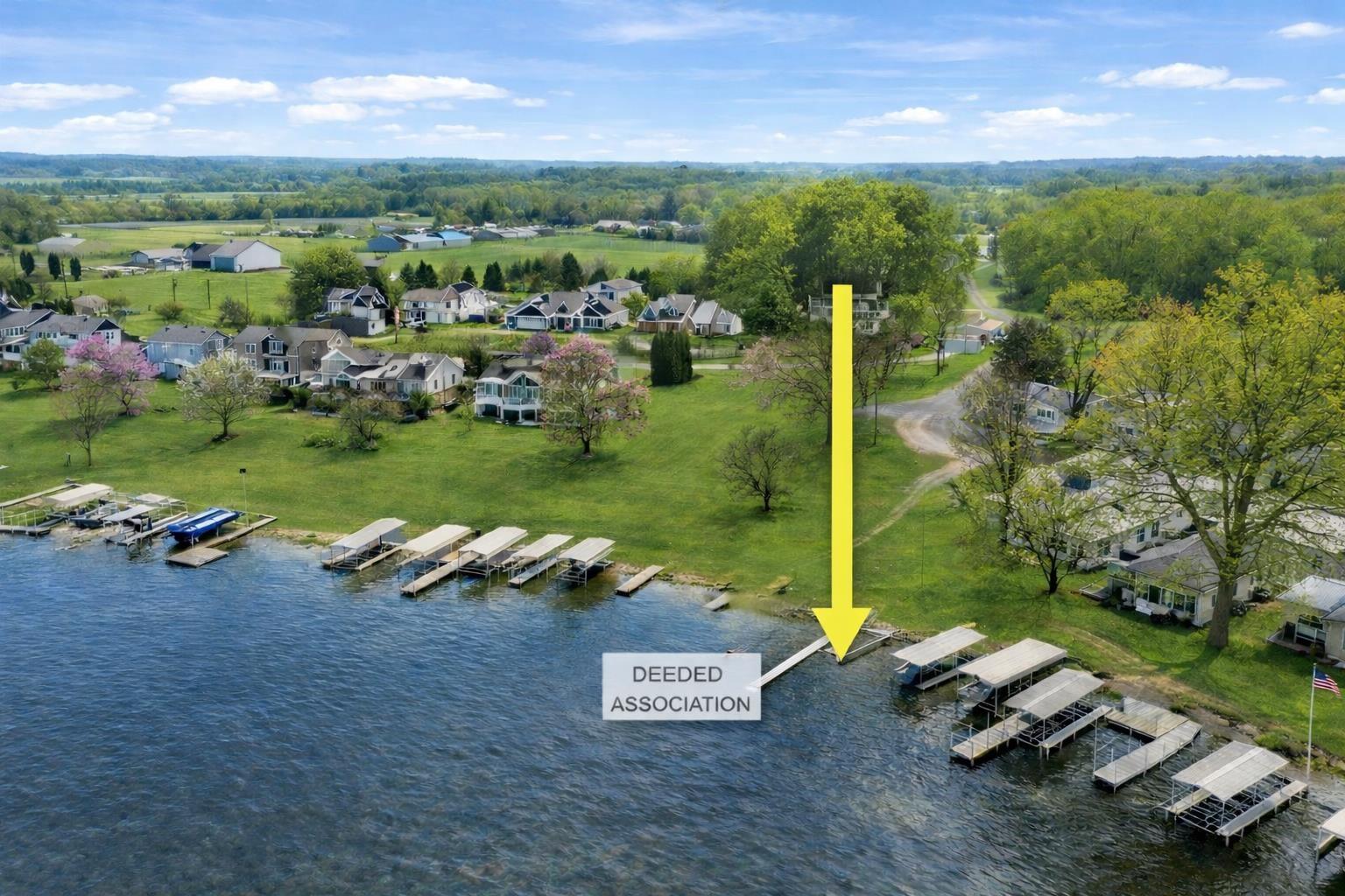 Image 2: Aerial view of residential area featuring a nearby body of water, Aerial View