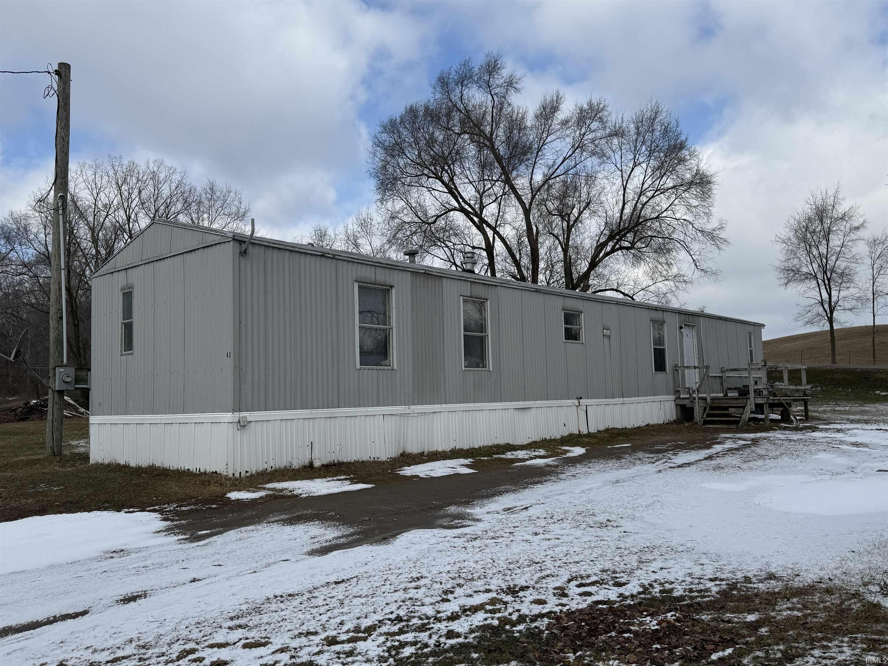 Image 0: View of snow covered house, Back Of Structure