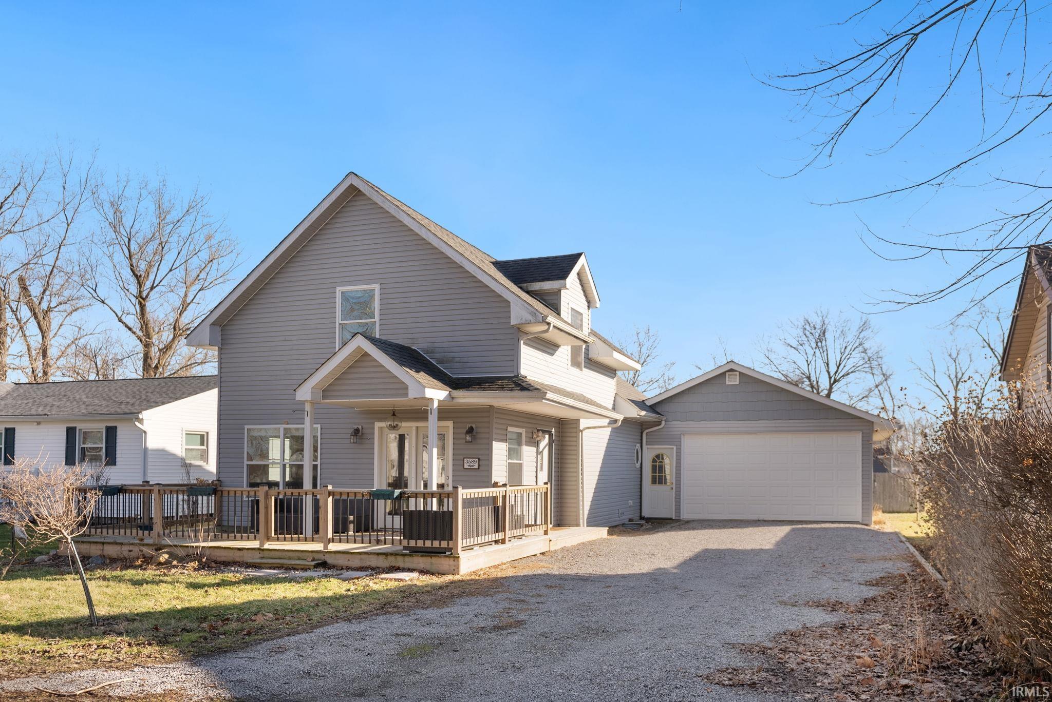 Image 2: View of front of house with driveway, Front Of Structure
