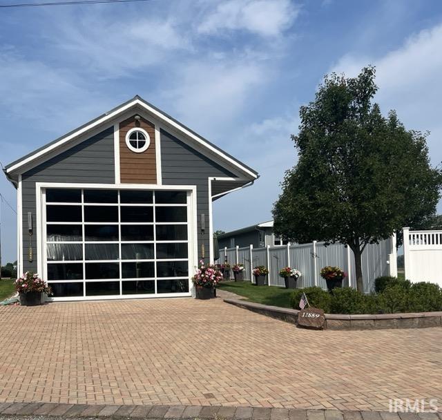 Image 0: View of front of property with an outbuilding and a patio, Front Of Structure